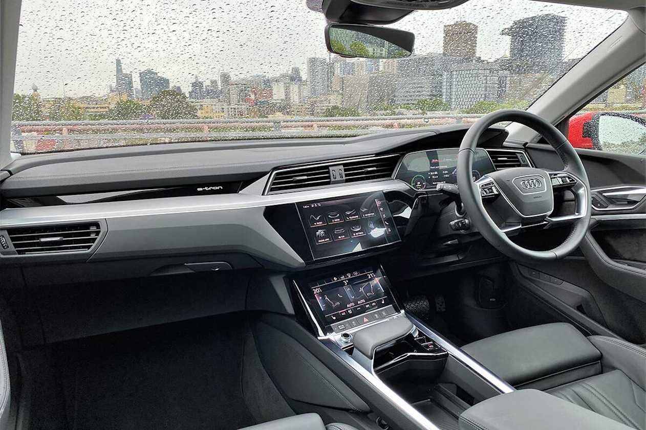 The Audi e-tron 50 quattro Sportback has a prestigious interior with leather upholstery, and its dual screens for media and climate control as you’d find on a Q7. (image: Richard Berry)