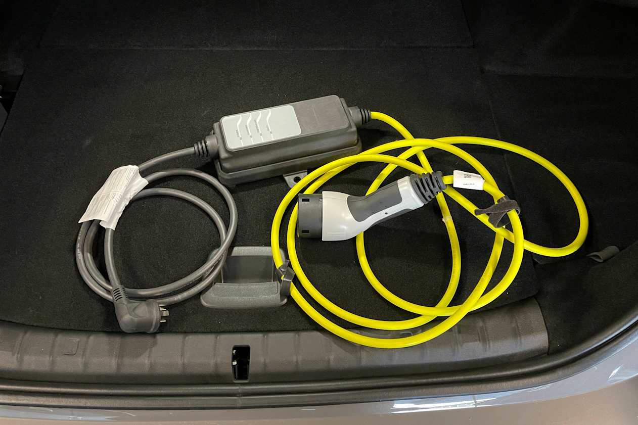 There is also a spot for the charging cable and its bag behind the left wheel arch.