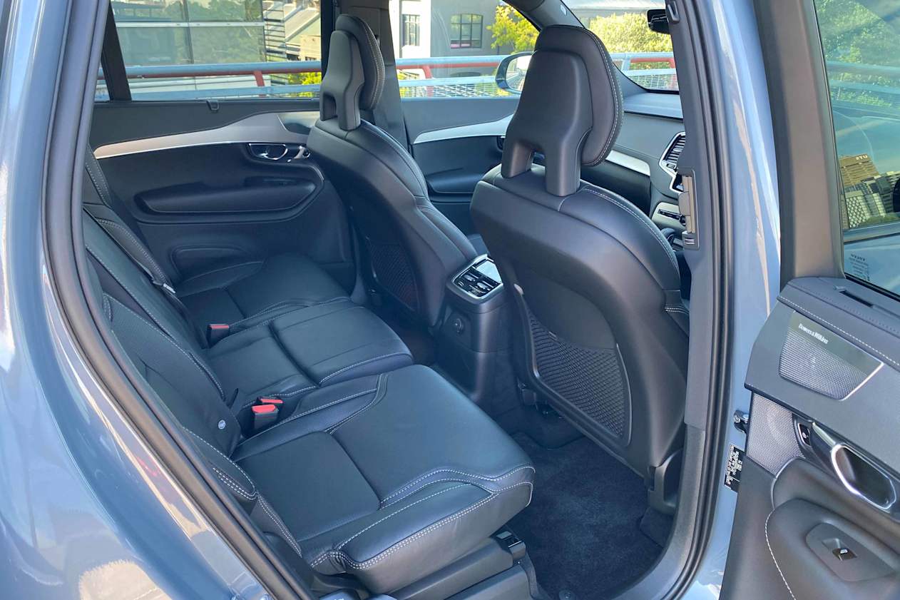 A children’s booster seat pops out of the centre of the second row.