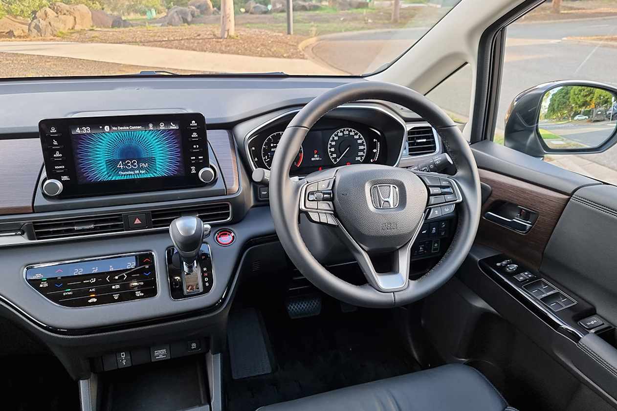 The shifter is on the dashboard to maximum interior space.