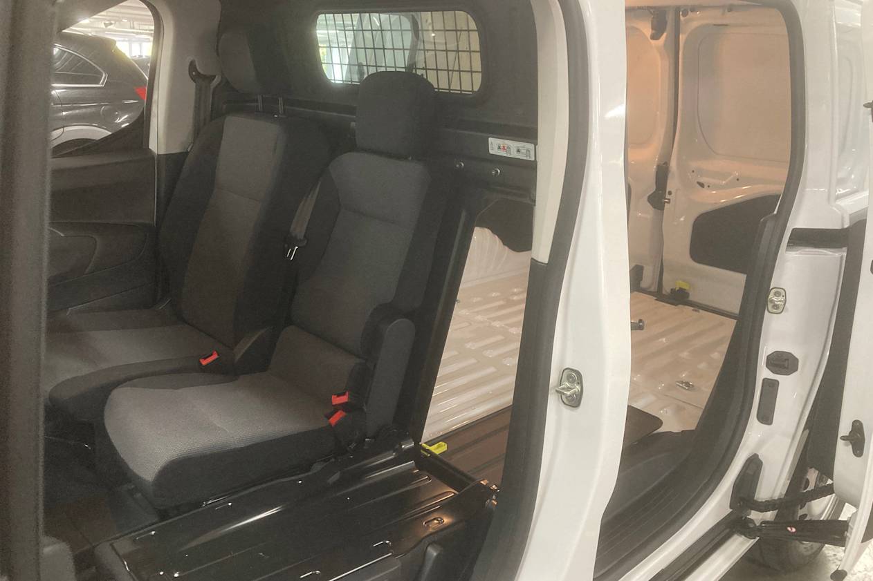 The outboard passenger seat folds down for ski-port like access to the rear.