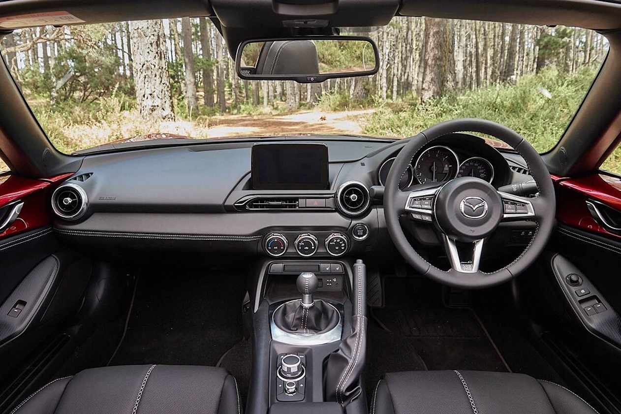 There’s not a lot to it, but leather upholstery adorns the steering wheel, gear selector, manual handbrake and dashboard insert. (Roadster GT RS variant pictured)