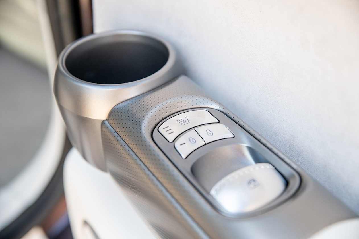 Amenities and storage spaces are plentiful in the GV60's second row. (Image: Tom White)