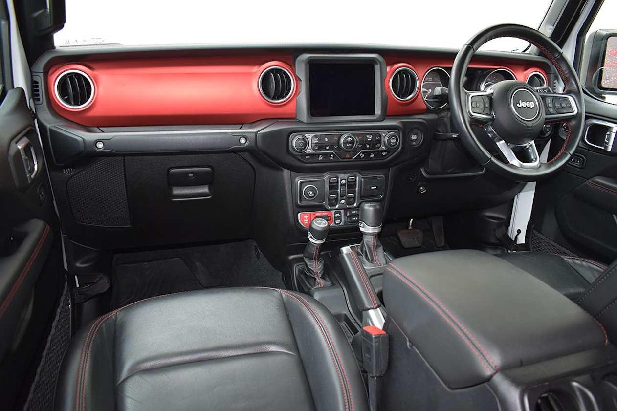 The interior includes ample black leather with contrasting red-stitching. (image: Mark Oastler)