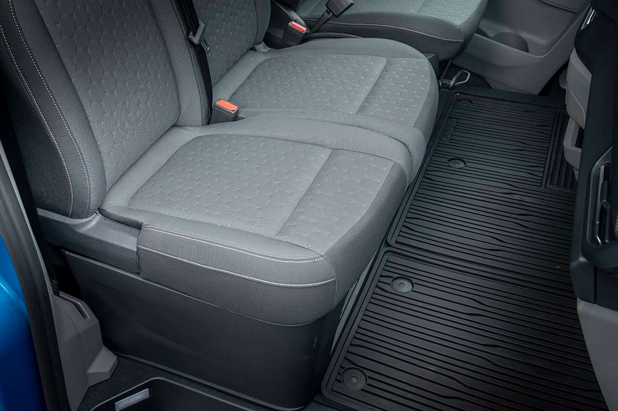 The driver’s seat seems more fully padded than the flimsy cushions of the (narrower) centre and passenger seats.