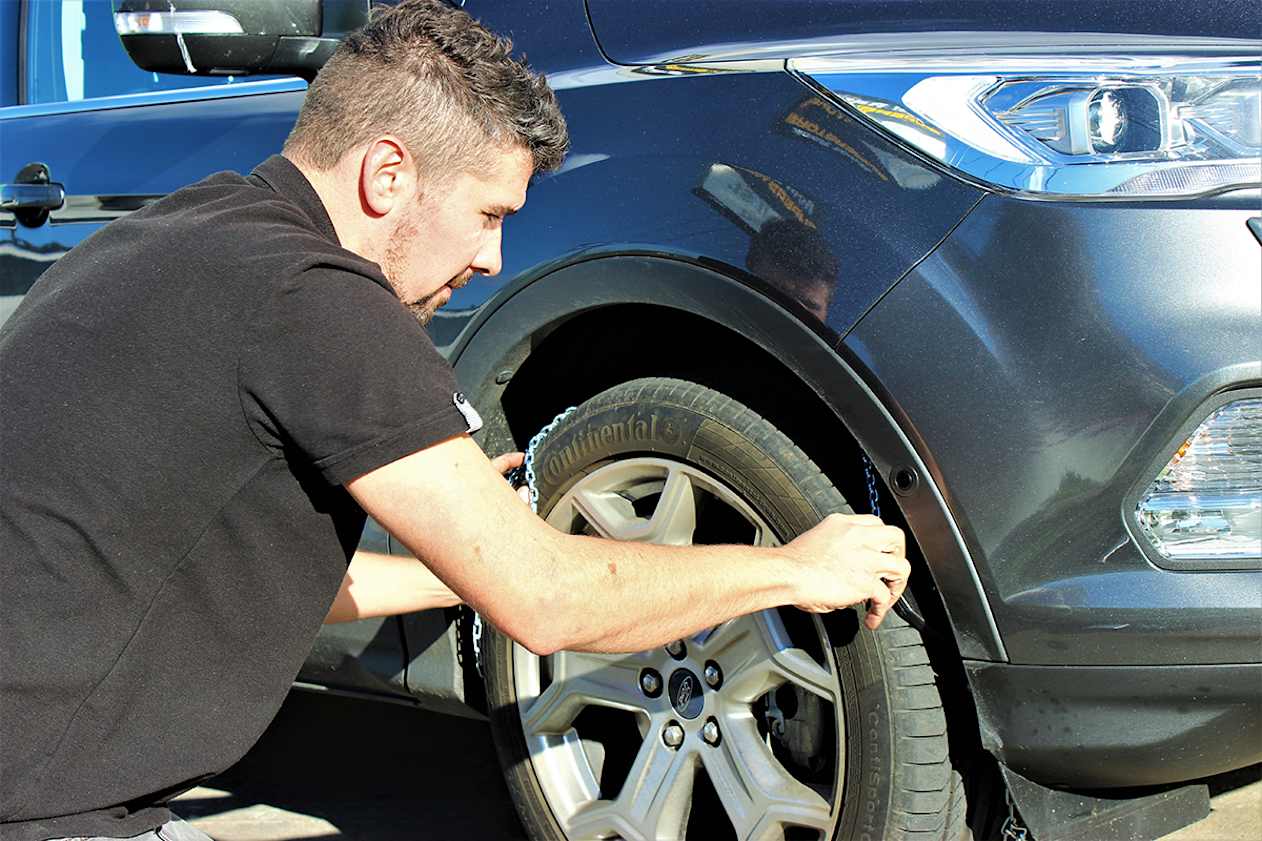 Test-fit the chains before you head for the snow. Ask staff at the store where you bought the chains to demonstrate how to fit them. (image credit: Tim O&#039;Brien)