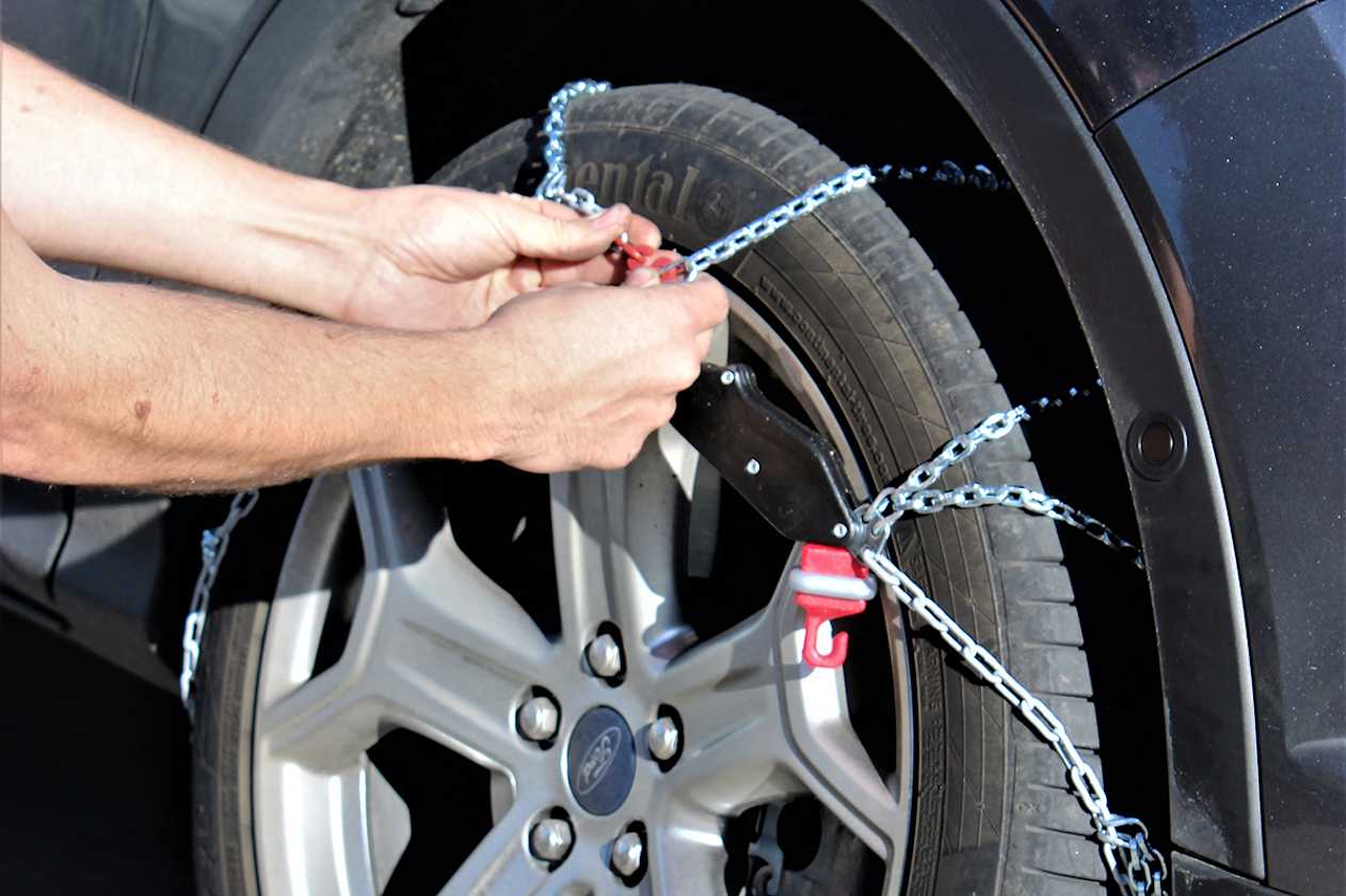 Test-fit the chains before you head for the snow. Ask staff at the store where you bought the chains to demonstrate how to fit them. (image credit: Tim O&#039;Brien)