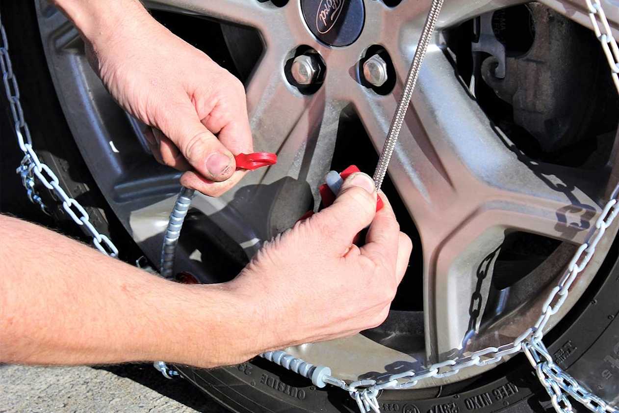 Test-fit the chains before you head for the snow. Ask staff at the store where you bought the chains to demonstrate how to fit them. (image credit: Tim O&#039;Brien)