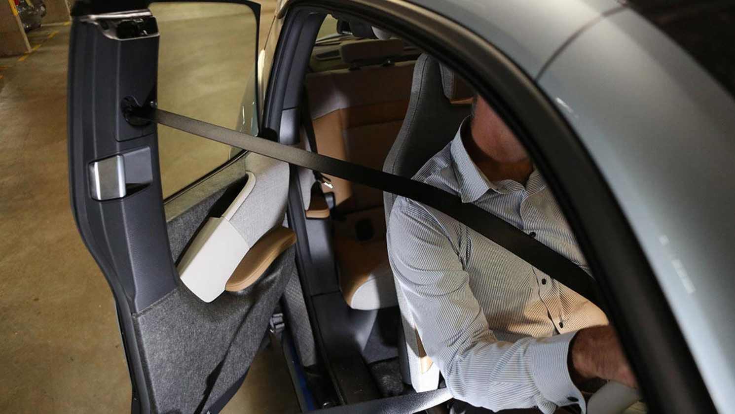 Opening the back doors can cause issues for the driver if they still have their seat belt on.
