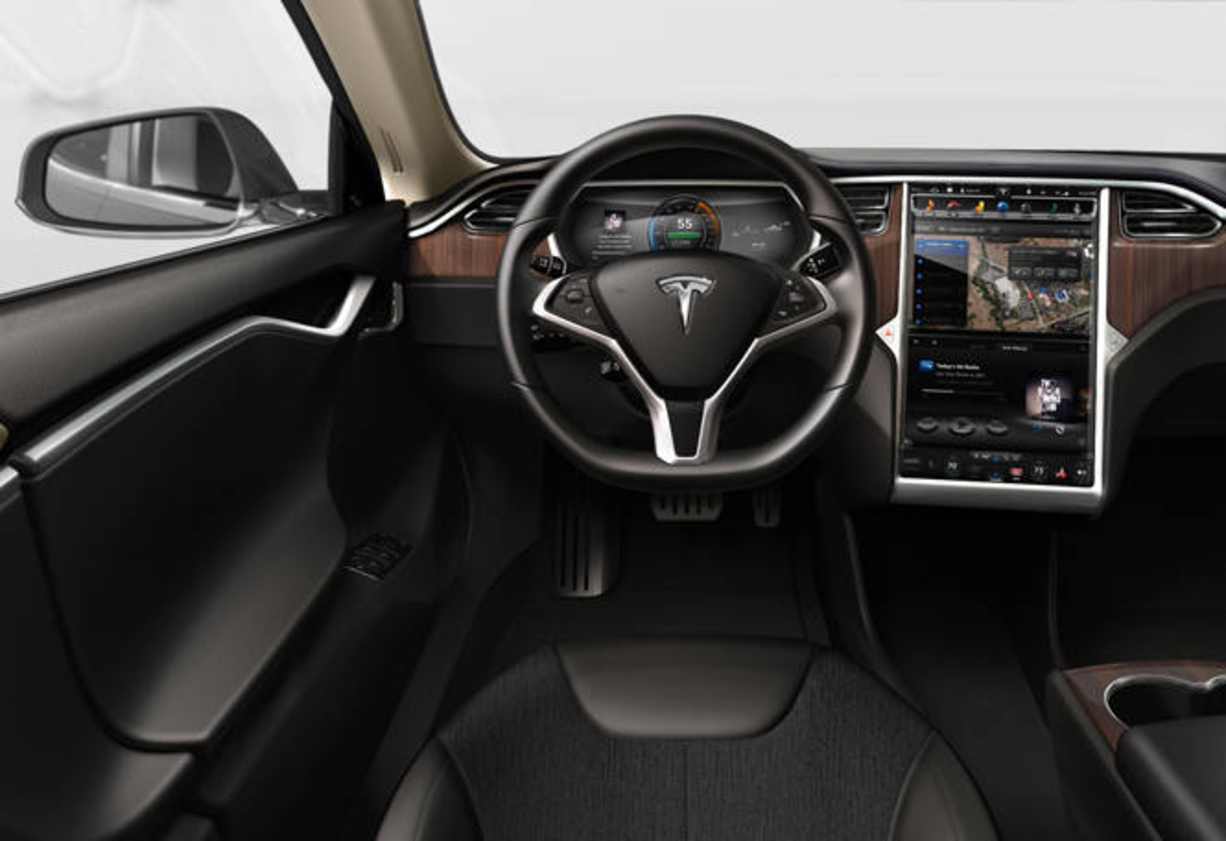 There&#039;s an enormous screen, easily the largest I&#039;ve seen in a car, angled towards the driver and looking exactly like an oversize iPad.