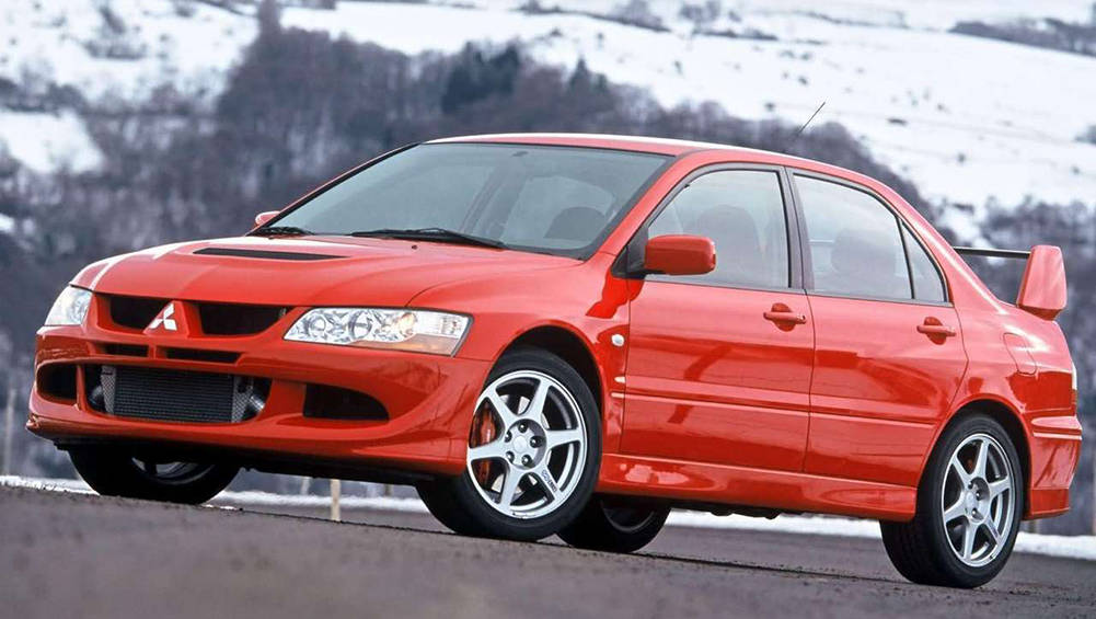 2004-Mitsubishi-Lancer-Evo-VIII-Sedan-Red-Press-Image-1001x565p.jpg