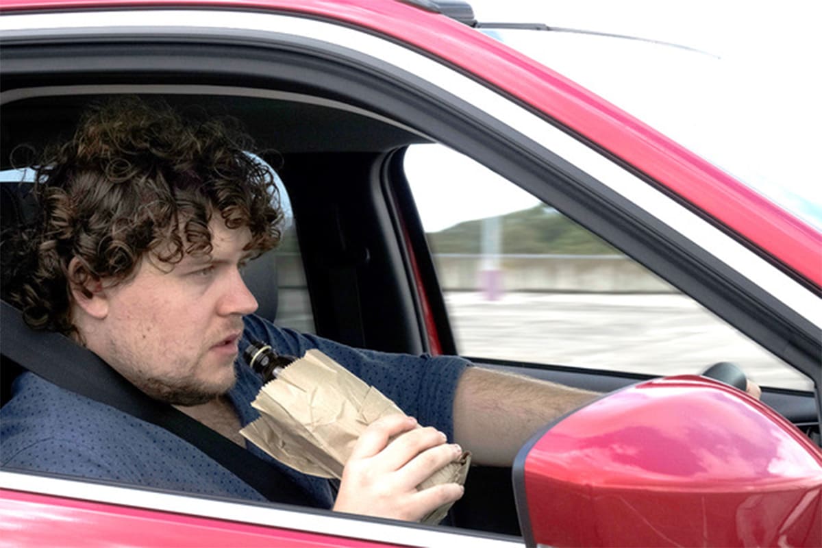 Is it illegal to drink alcohol in a car while driving? | CarsGuide