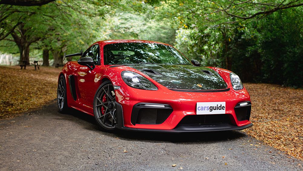 https://carsguide-res.cloudinary.com/image/upload/f_auto%2Cfl_lossy%2Cq_auto%2Ct_default/v1/editorial/story/hero_image/2023-Porsche-Cayman-GT4-RS-Coupe-Red-DMcC-1001x565-%281%29.jpg