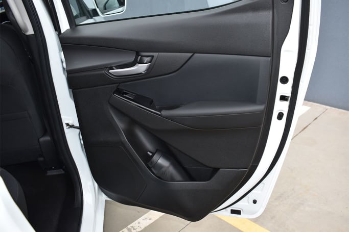 Rear passengers get a large-bottle holder and small storage nook in the base of each door. (Image: Mark Oaster)