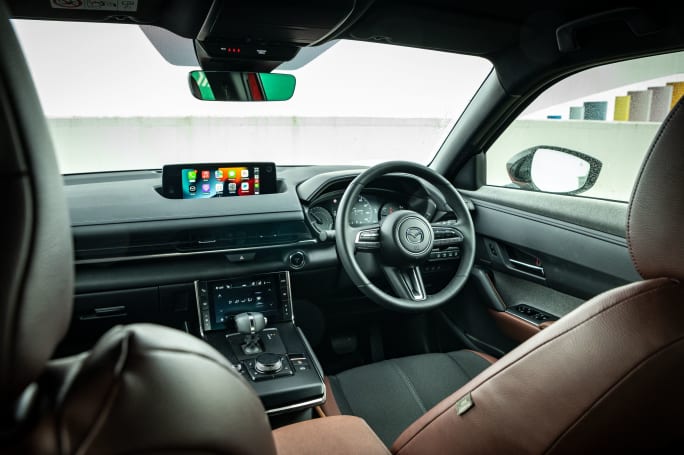 The paddles on the steering wheel adjust its four levels of regenerative braking.  (image credit: Tom White)