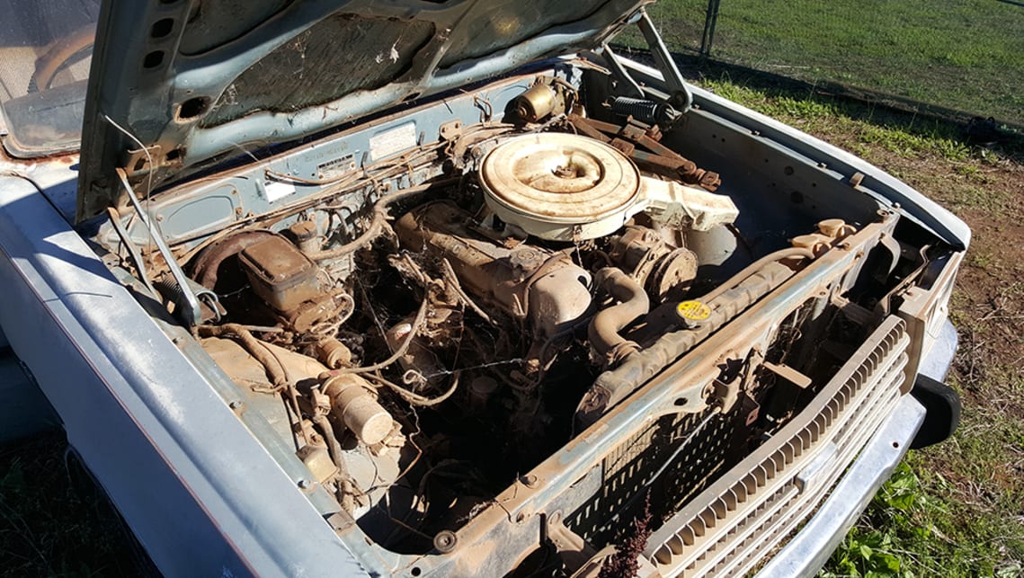 Aside from a missing battery, all the cobwebs and rodent residue hide a surprisingly complete engine bay.