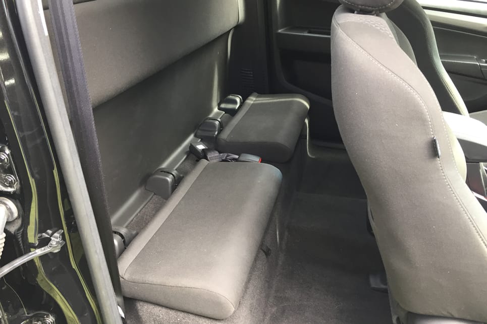 The second row is actually a hard storage bench of sorts with two flip-top padded rectangular jump seats. (Image credit: Vani Naidoo)