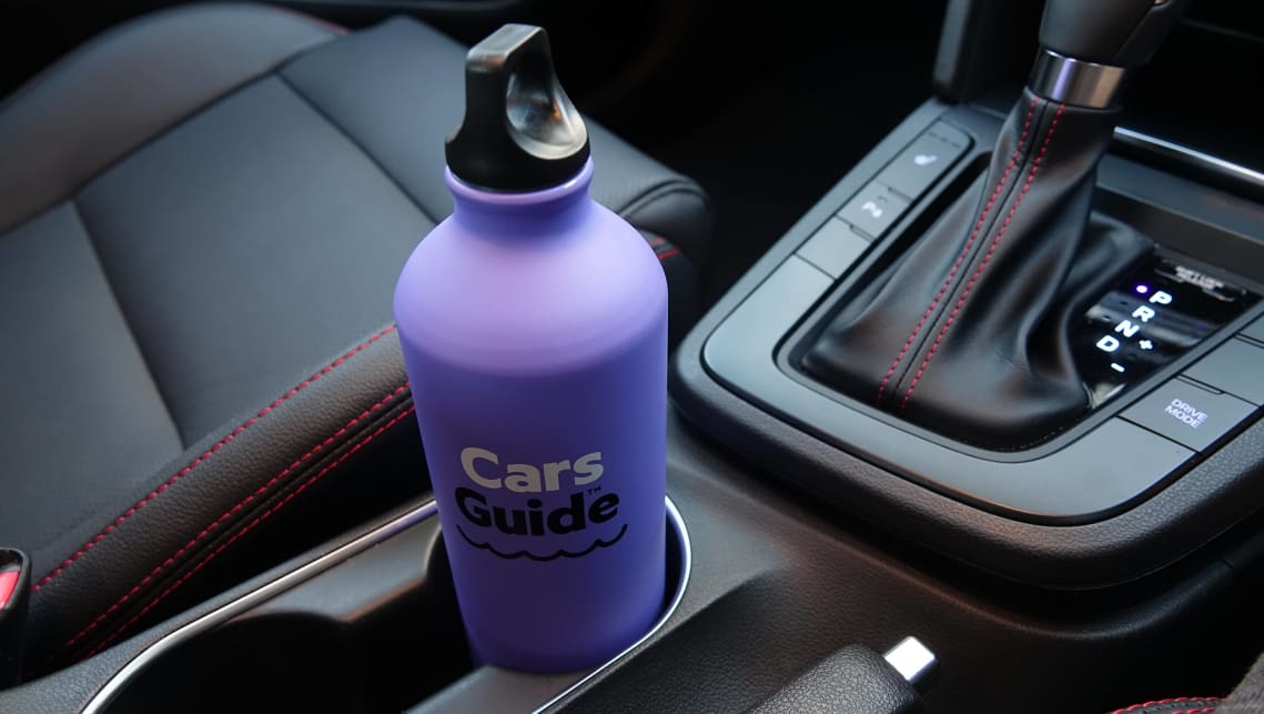 Cupholders can be found between the front two seats, as well as in all four doors.