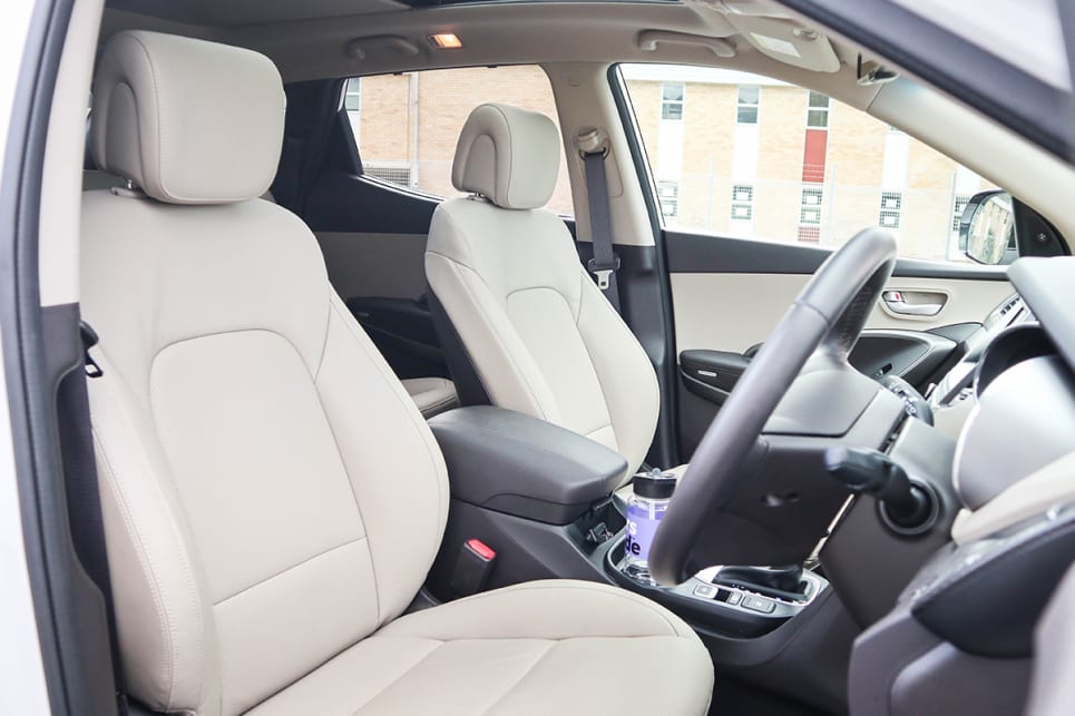 Up front the driver and passenger have plenty of room with broad medium/firm seats. (2018 Hyundai Santa Fe model shown)