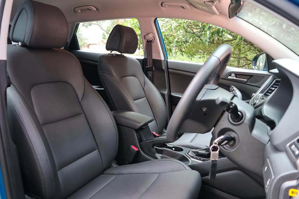 The leather-appointed seats offer more practicality than luxury, given their easy-wipe surface that's great for young families. (image credit: Tim Robson)