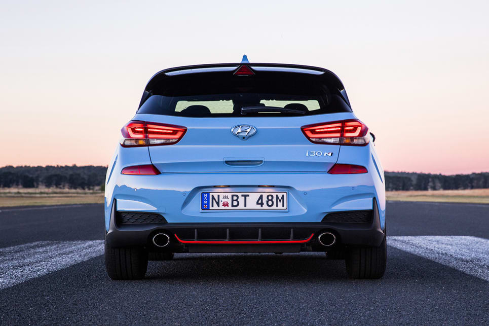 The rear spoiler provides downforce and helps maintain aero balance.