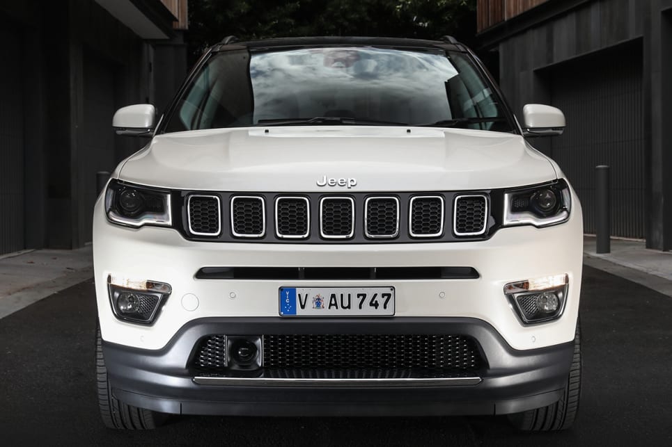 The Compass has a high, broad and flat bonnet, squared-off headlights, signature seven-slot grille, and bulky, strong wheel arches. (Jeep Compass Limited pictured)