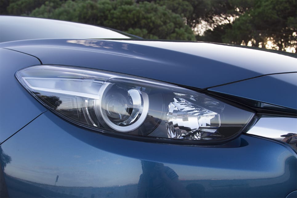 The Mazda 3 comes with projector-style halogen headlights. (2018 Touring model shown)