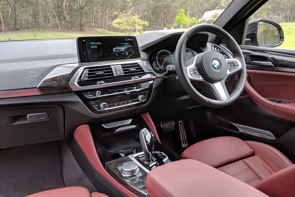 The electronically adjustable drivers' seat draped in Tacora Red Vernasca leather (a $2500 option) looks the part and offers plenty of comfort and support.