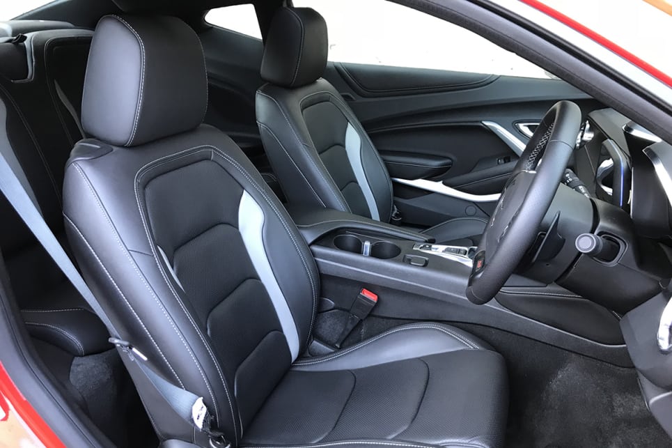 There are tiny pockets in the doors, a medium-size glove box, two cupholders (one small, one large) and a gratuitously placed 12-volt outlet in the centre console.