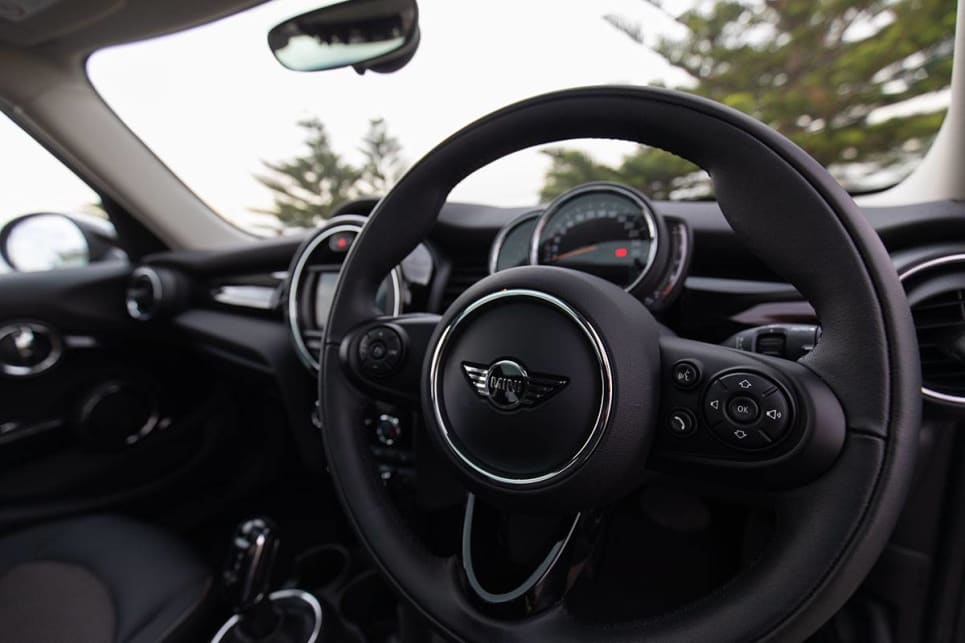 With an old-school leather-trimmed steering wheel.