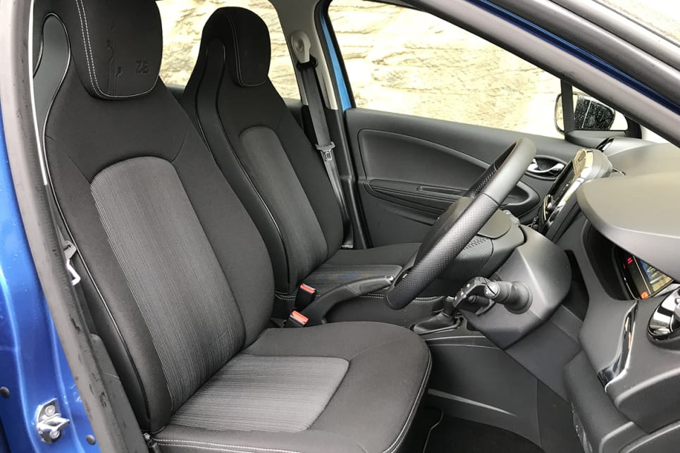 The front seats feature a decorative curved panel, defined by dark piping on each side of the backrest.