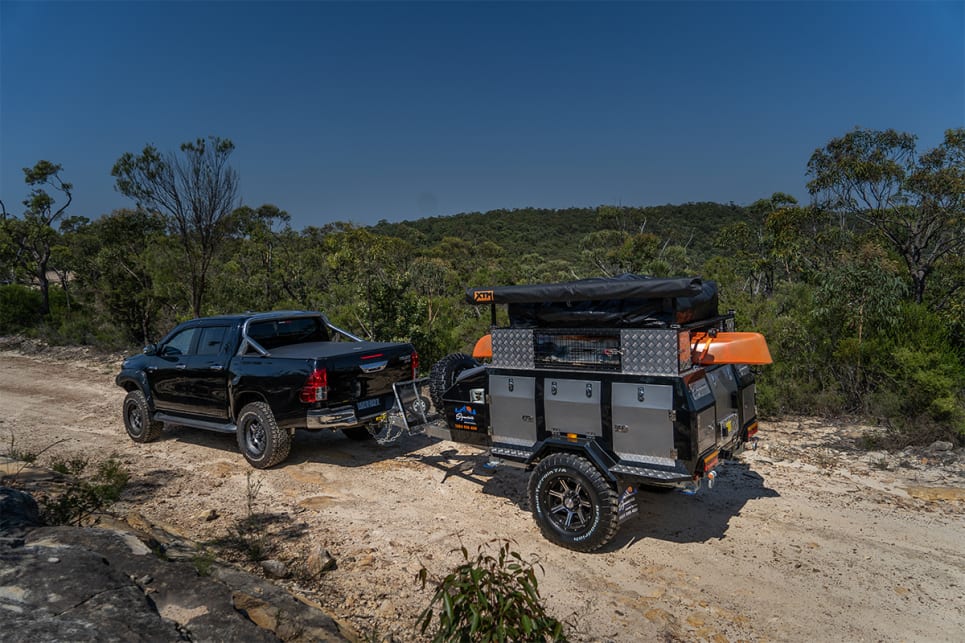 The small expedition trailer relies on a roof-top tent for accommodation.
