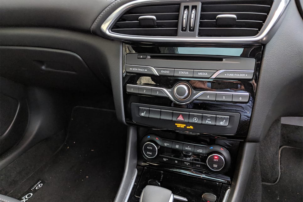 The dash layout feels dated, with numerous buttons down the centre stack.