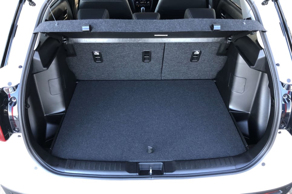 The boot has a false floor under which you can hide a decent amount of stuff, including small bags.