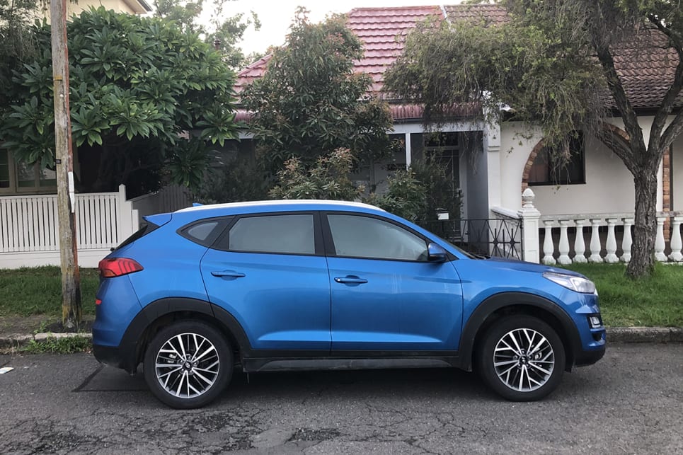 The Tucson sat still outside my house, a neon-blue reminder of the automotive freedom we'd lost, until it was time to return it. (image: Andrew Chesterton)