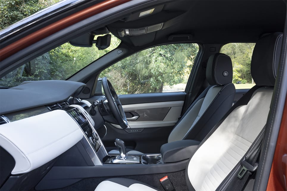 In terms of front seat storage the Discovery Sport shines with very large door bins, generous centre cupholders, a big console box and deep glove box. (image: Tom White)