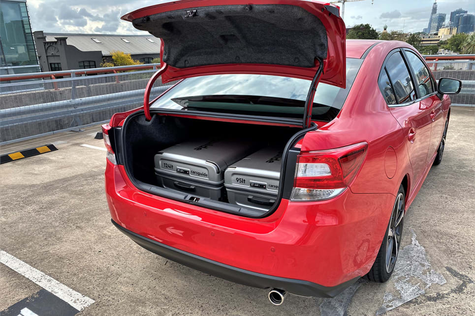The boot in the sedan is 115 litres larger in cargo capacity at 460 litres (VDA) and it fit the two CarsGuide suitcases with ease. (image: Richard Berry)