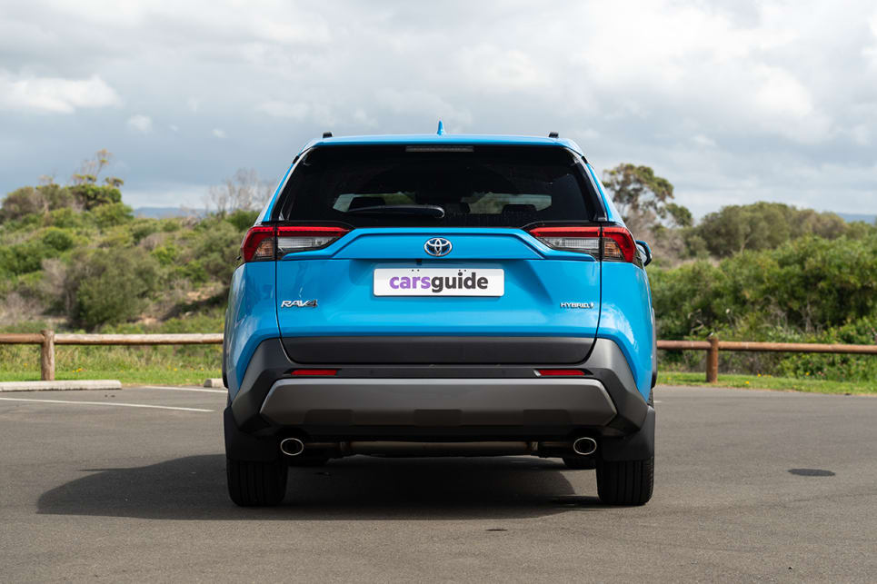 The RAV4 Hybrid models, which have blue-themed Toyota badges.