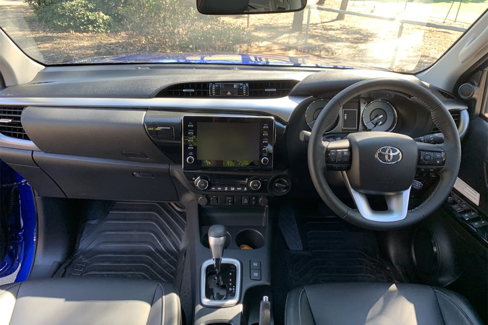 The HiLux has a dual glovebox setup, cup holders between the front seats, pop-out cup holders on the outer edges of the dashboard, covered centre console bin, and door pockets with bottle holders.