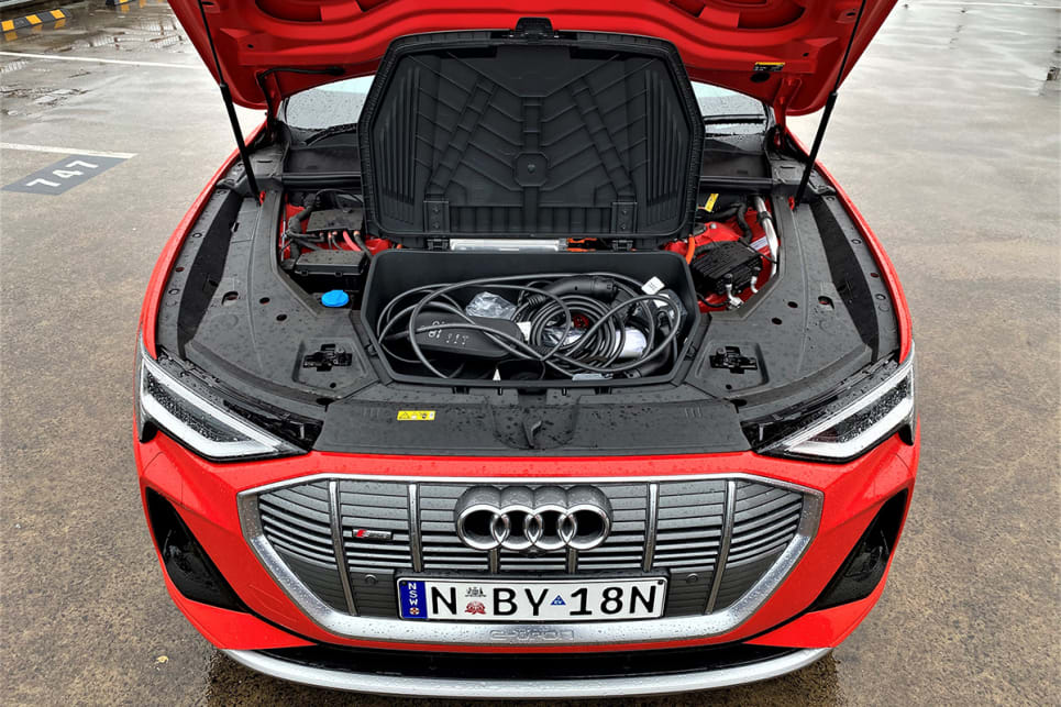 Under the bonnet there’s a large storage box for the charging cables. (image: Richard Berry)