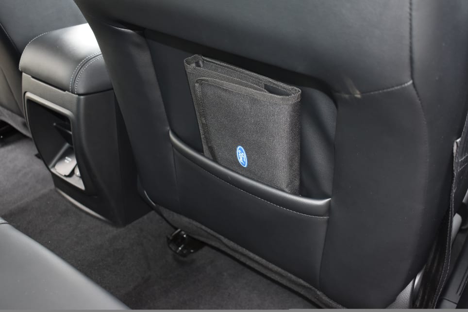 Rear passengers have a flexible pouch on the backrest of each front seat.
