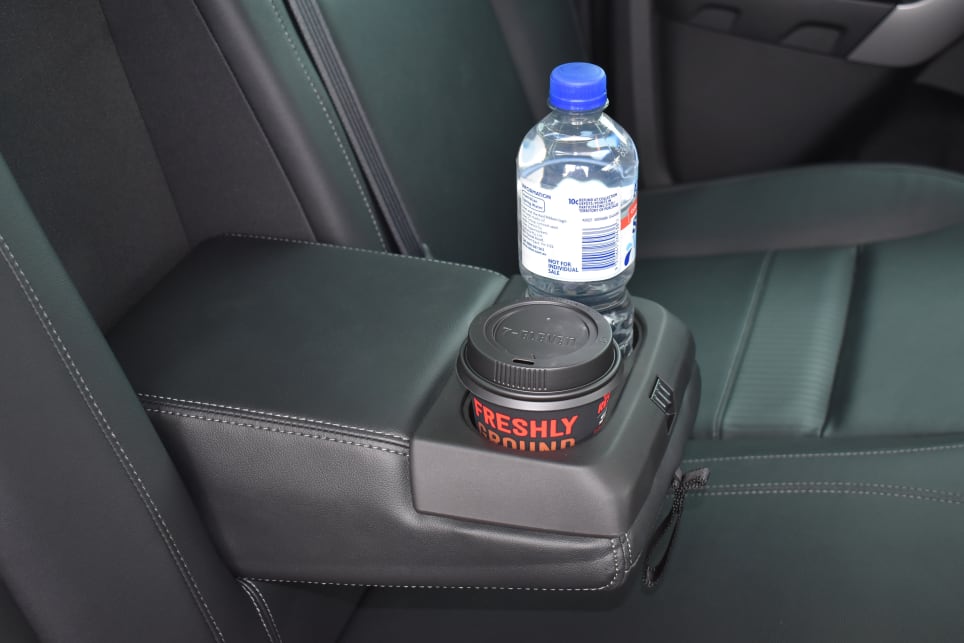 The centre rear seat folds down to reveal two more small-bottle/cup holders. 