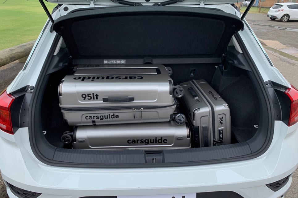 With the boot floor lowered, the T-Roc could fit all three CarsGuide suitcases.
