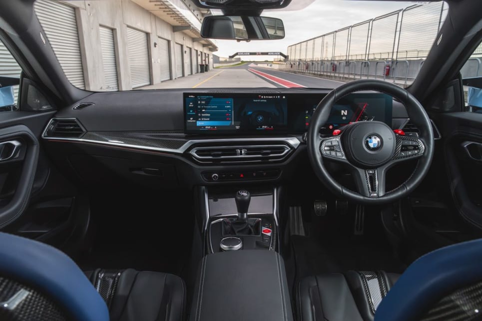 Inside, it’s plenty sporty feeling, with hard-backed sports seats, lashings of carbon-fibre-look trimmings and the bright red M buttons on the steering wheel.
