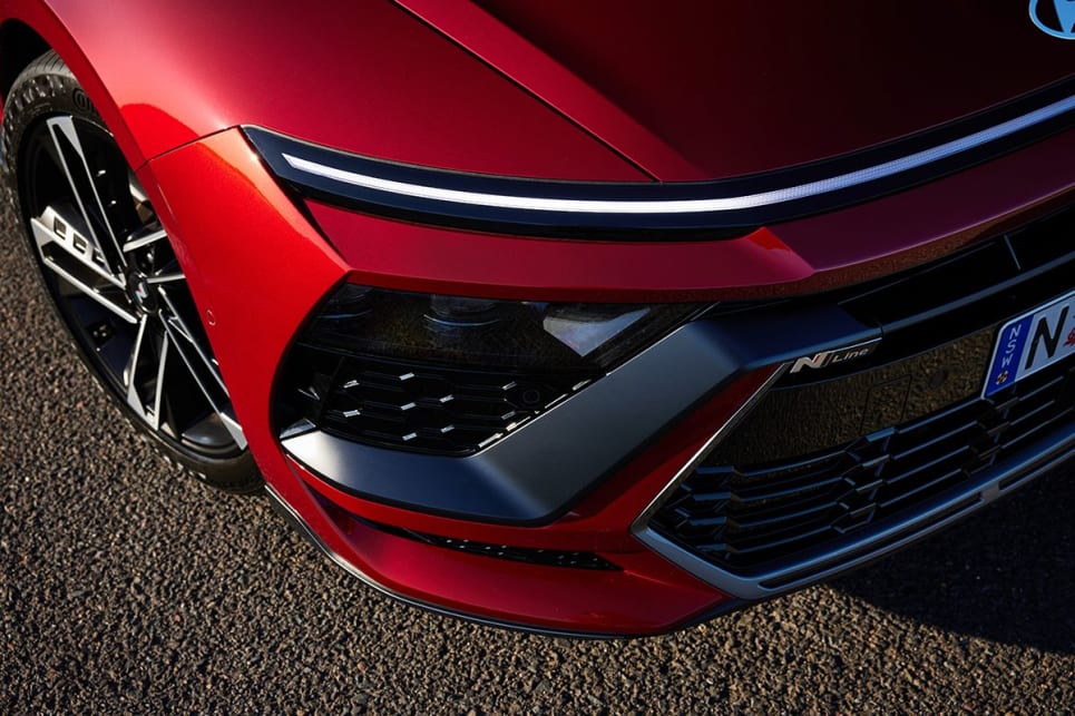 The hidden LED headlights flanks the large, dark and low-set grille.