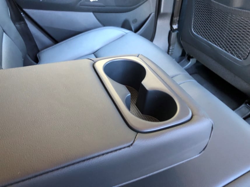 There are four cupholders, two in the back, and two in the front. 