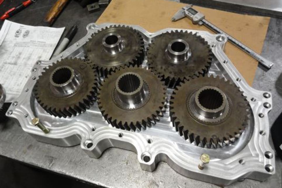 Crank power comes in via the two side gears on the bottom, spinning the two top gears, then the main centre output gear for the transmission. (image credit: Holly Performance Products/Facebook)