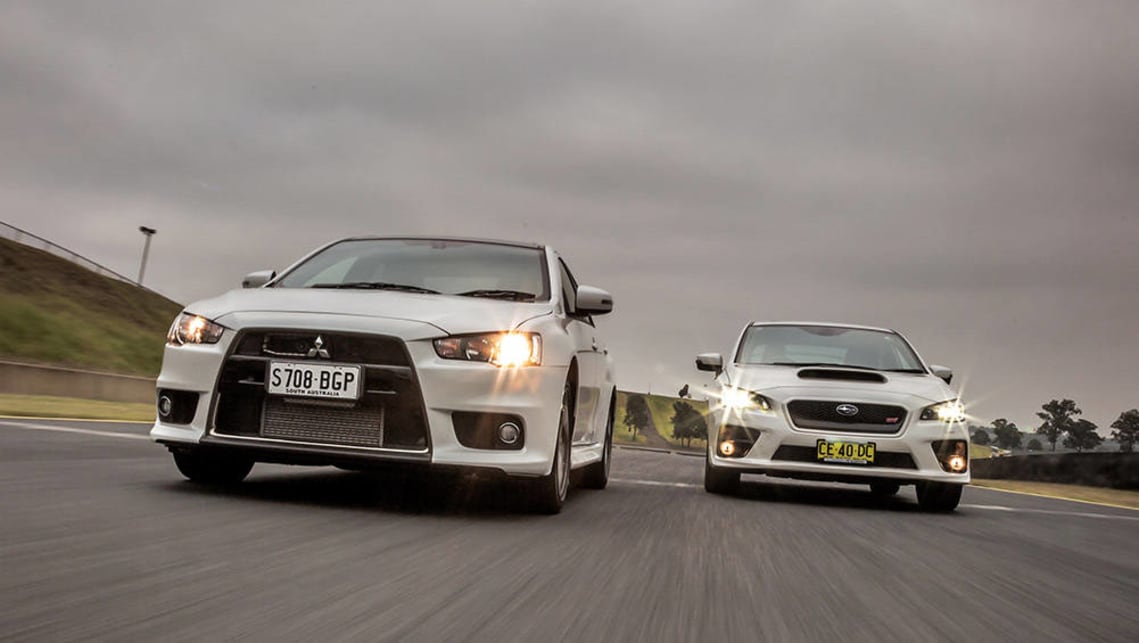 2015 Mitsubishi Evo Final Edition goes head to head with 2015 Subaru WRX STI