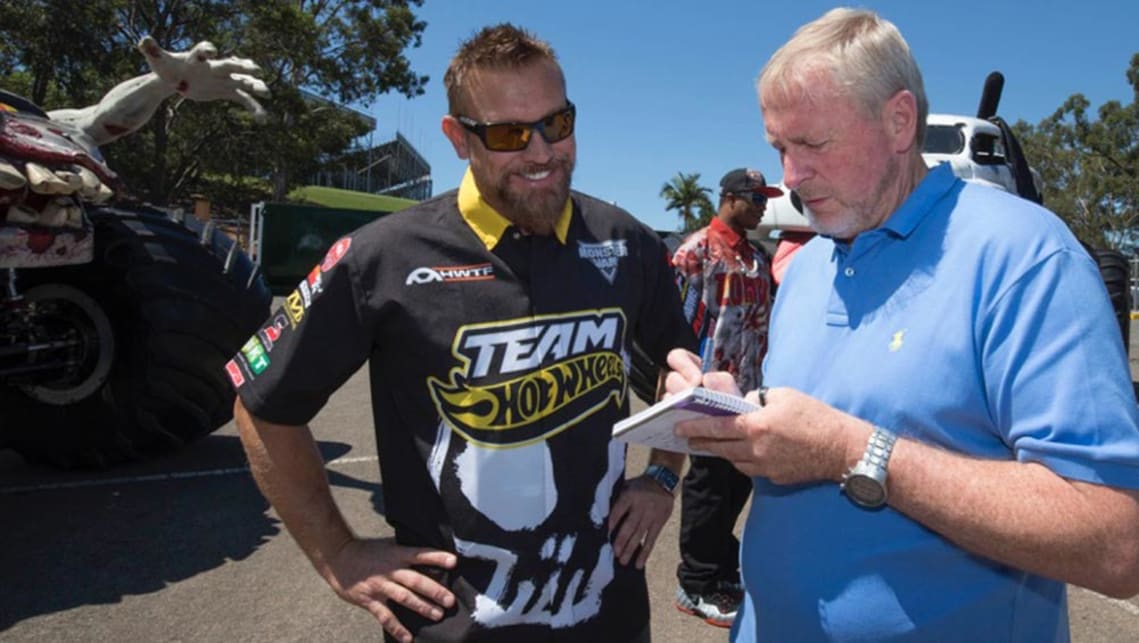 Competitor Scott Buetow (left) gives Paul Gover the lowdown on driving Monster Trucks