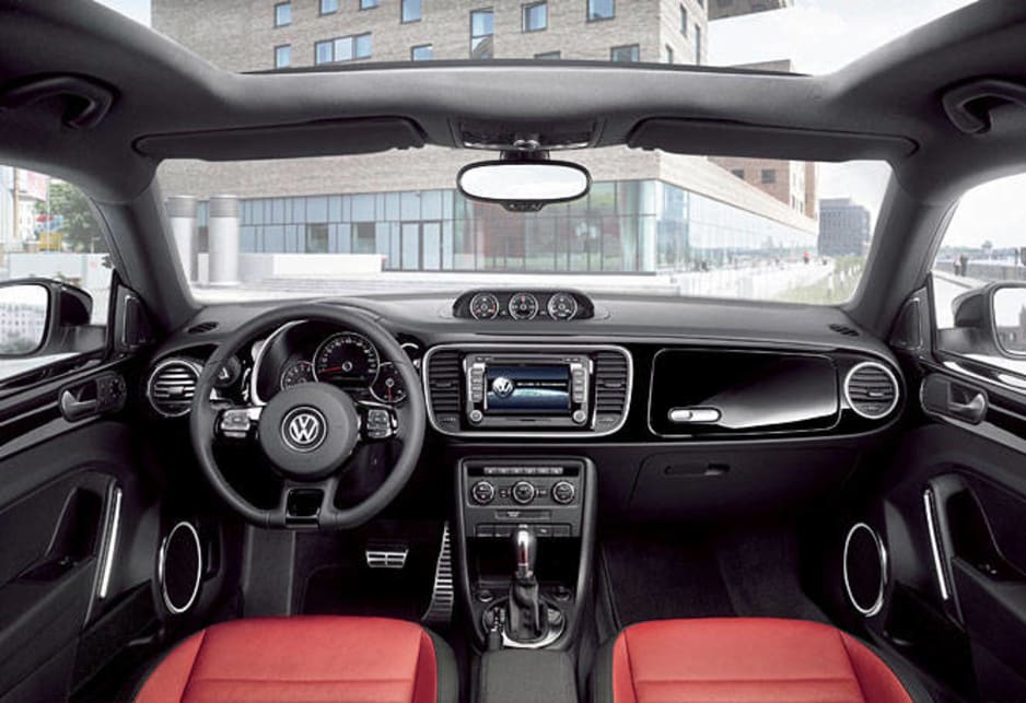 The VW Beetle interior includes a glovebox styled on the 1960s model (there are actually two gloveboxes) and a sling grip on the B-pillars. There is also more room - four adults can fit inside the Beetle now. 